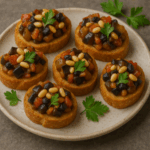 Mini Caponata Crostini with Pine Nuts & Currants